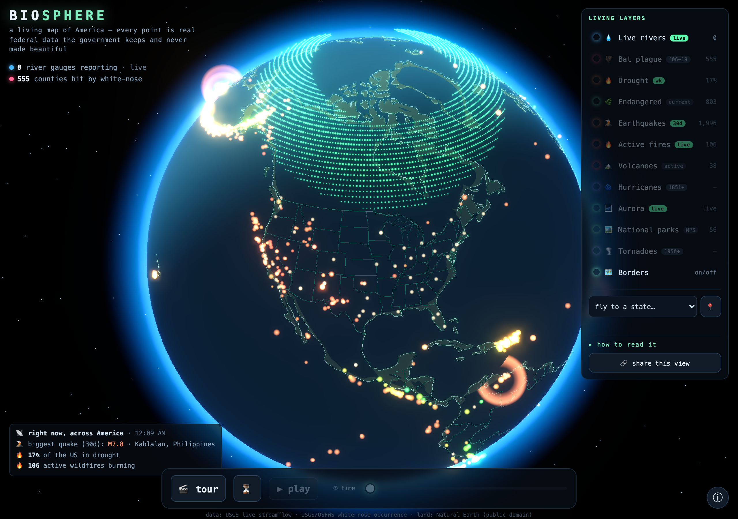 3D WebGL globe of Earth facing North America, glowing with live U.S. federal data: green aurora ribbons over the Arctic, orange earthquake and wildfire points, a hurricane ring in the Atlantic, and a bright blue atmosphere, with the BIOSPHERE title and layer panel.
